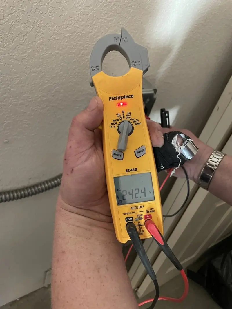 Voltage testing with clamp meter during Outlet Installation in McGregor